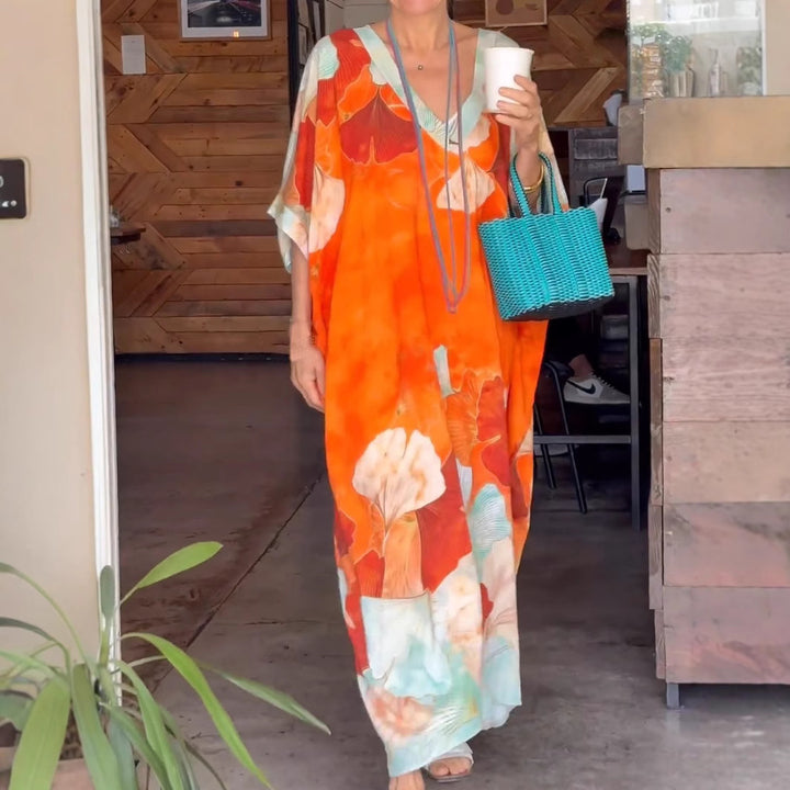 Dame Elegant kaftan-kjole med blomsterdesign og brede ærmer Stilla