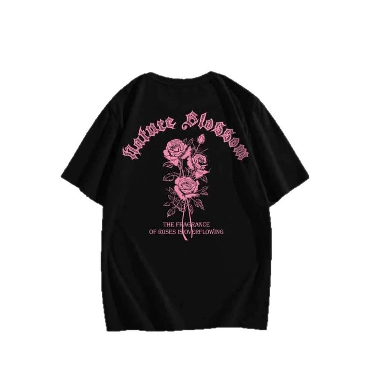Dame T-shirt med floralt motiv og kreativ tekst Skovae