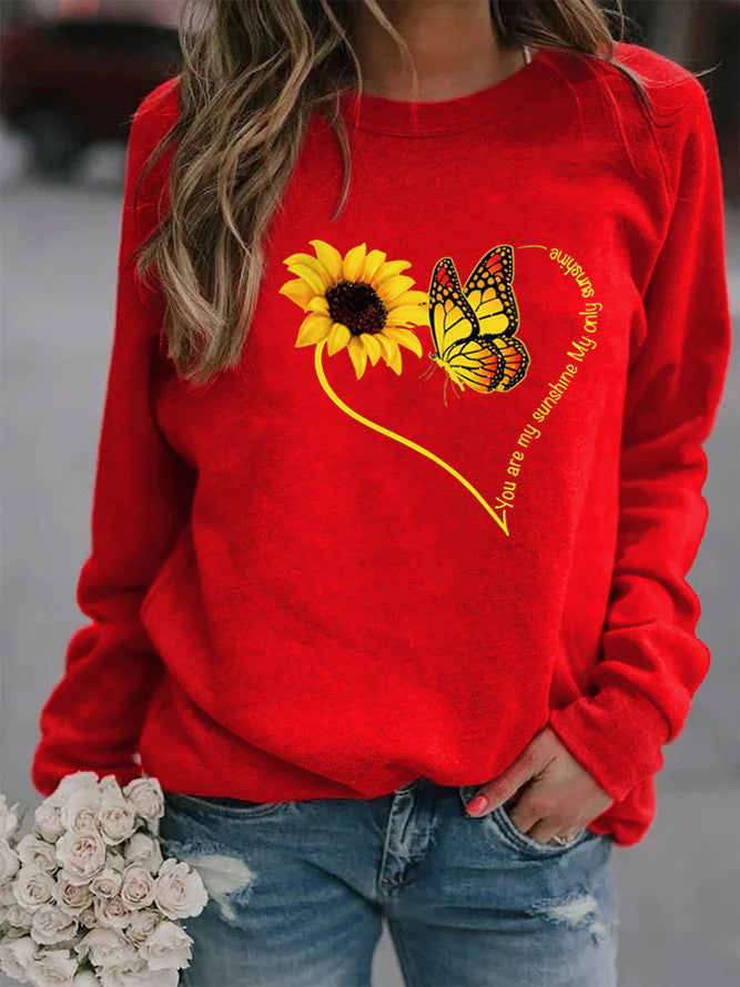 Kvinders sweatshirt med grafisk sommerfugl og solskinsmotiv Stilla