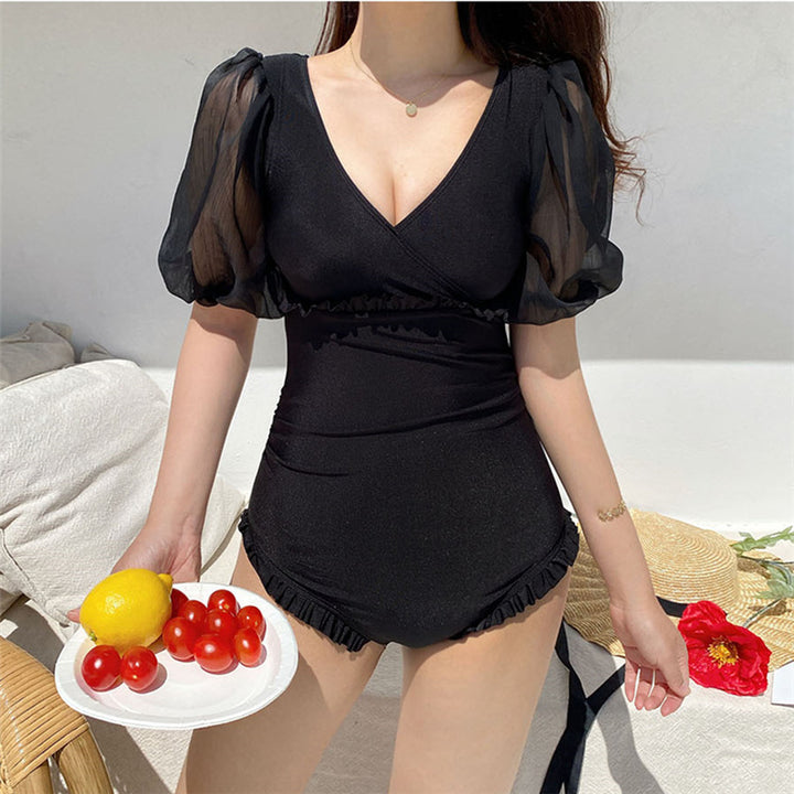 Dame heldragt-badtøj med elegante puffærmer og moderigtigt V-udskæring Stilla