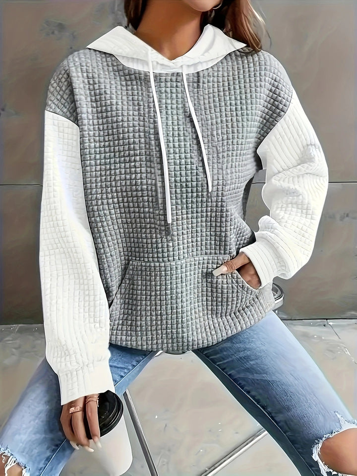 Dame hoodie med struktureret design og praktiske lommer Stilla