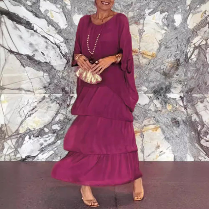 Dame maxikjole med flydende skirt og elegante flæsedetaljer Stilla