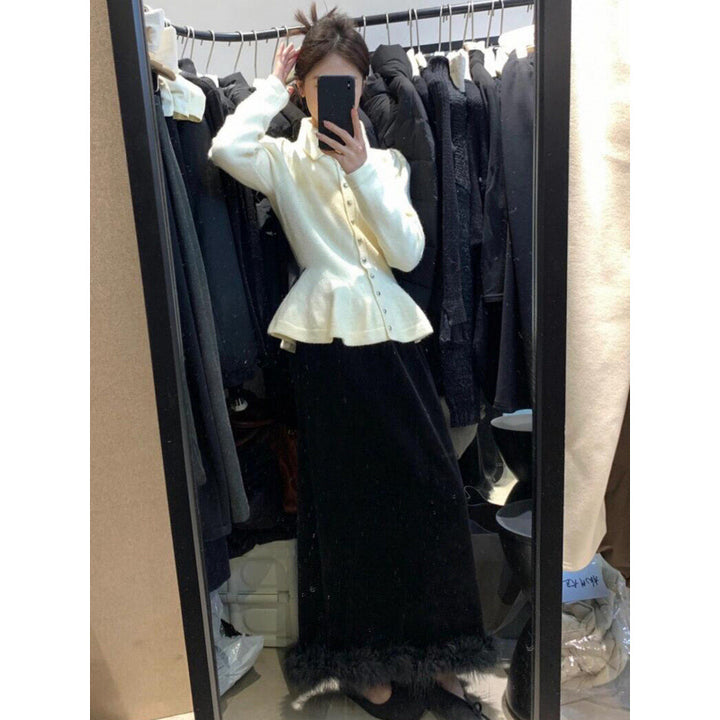 Kvinders peplum-top lavet af blødt strik med elegante knapper Stilla