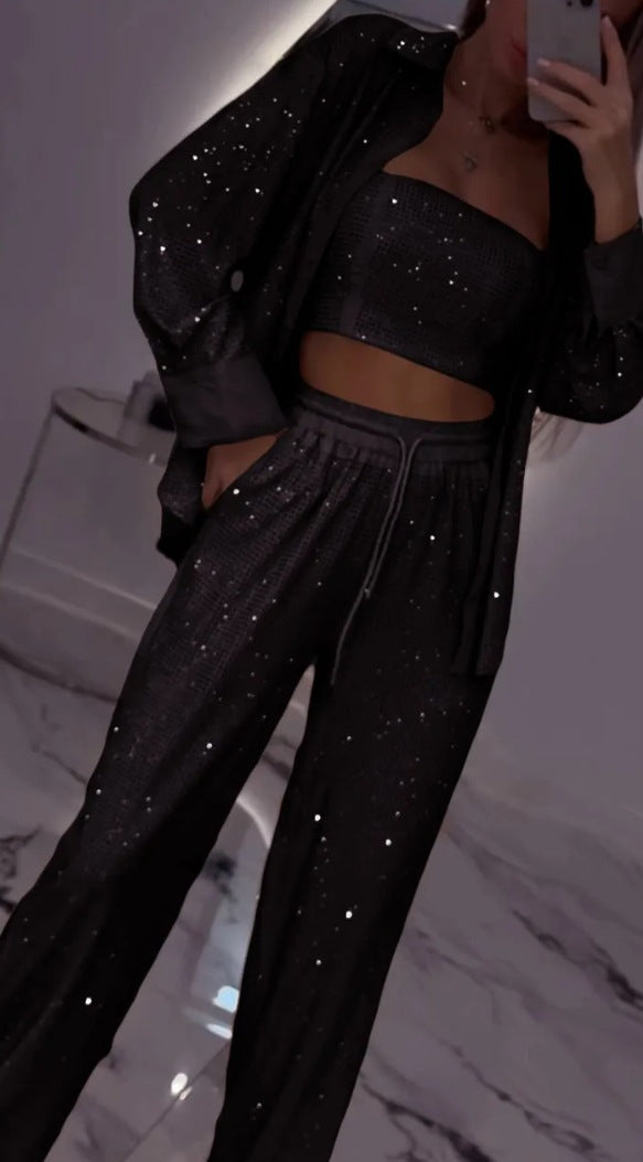 Dame fritids-loungewear sæt med glitrende top og elastiske bukser Stilla