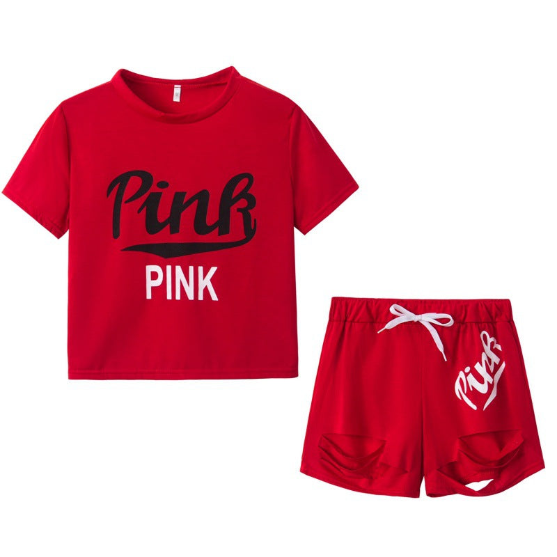 Damer sporty t-shirt og shorts sæt med løs pasform og kontrastprint Stilla