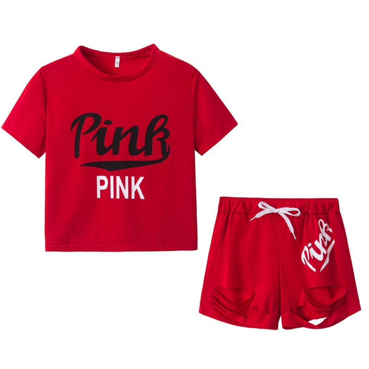 Damer sporty t-shirt og shorts sæt med løs pasform og kontrastprint Stilla