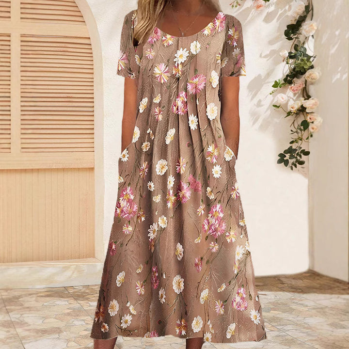 Dame Maxikjole med blomsterdesign og praktiske lommer Stilla