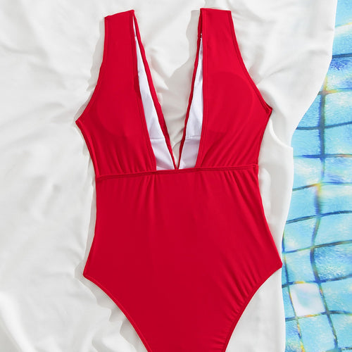 Dame one-piece badedragt med dyb V-udskæring og dekorativ taljebælte Stilla