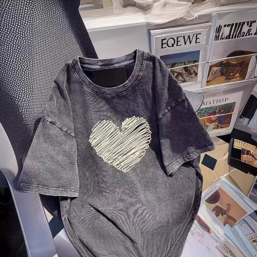 Dame T-shirt med kreativt hjerte-motiv og inspirerende slogan Stilla