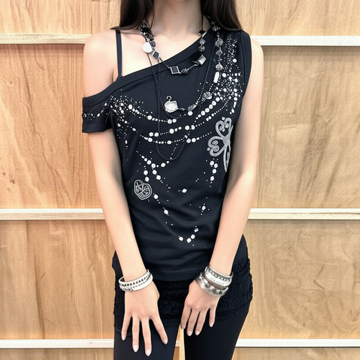 Dame top med off-shoulder design og funklende detaljer Skovae