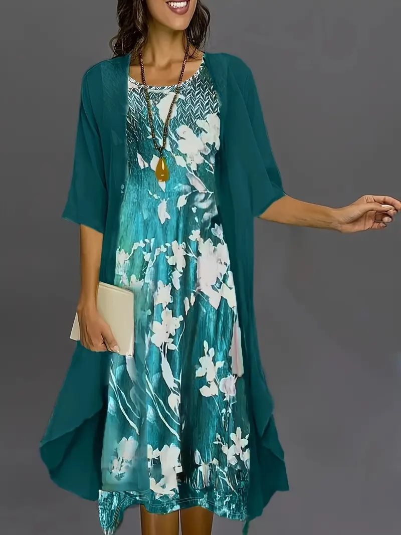 Dame elegant fritidskjole med asymmetrisk kant og floral design Stilla