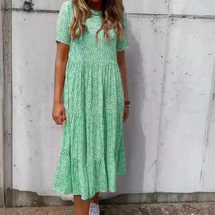 Dame Midi-kjole med delikat blomsterprint og luftig silhuet Stilla
