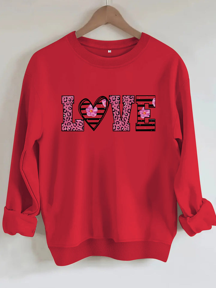 Kvinders sweatshirt med moderne leopard hjerte design og behagelig pasform Stilla