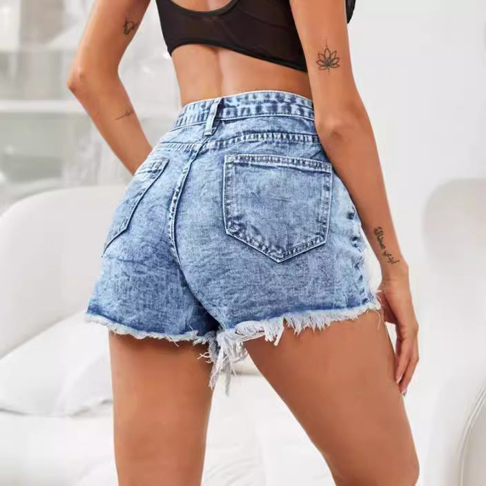 Dame Ripped Denim-Shorts med høj talje og fashionable distressed-look Stilla