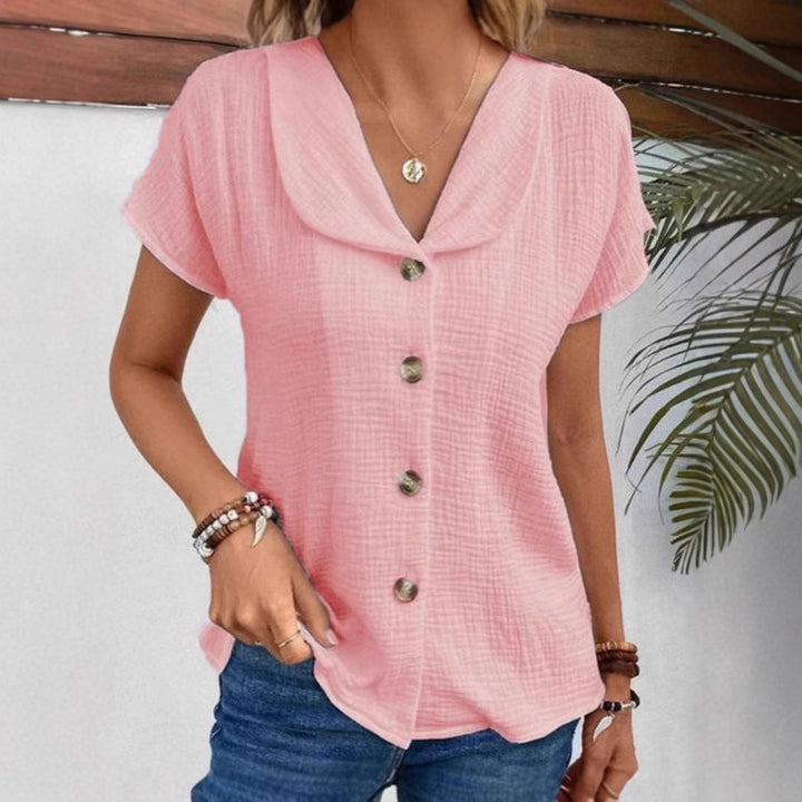 Damebluse med elegant klapkrave og dekorative knapper Stilla