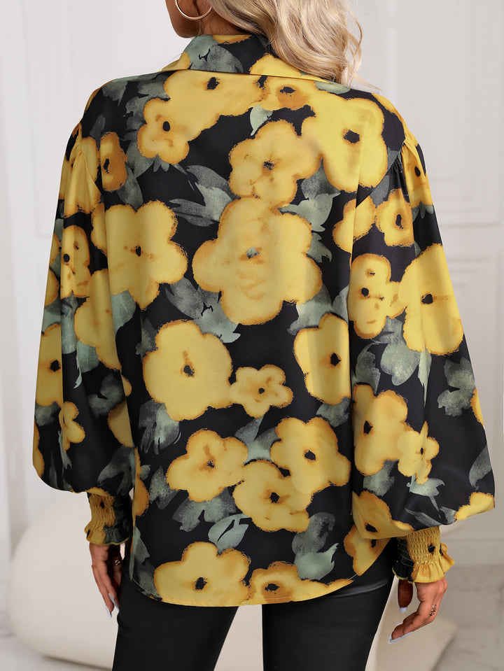 Damebluse med farverigt blomsterprint og luftige ærmer Stilla
