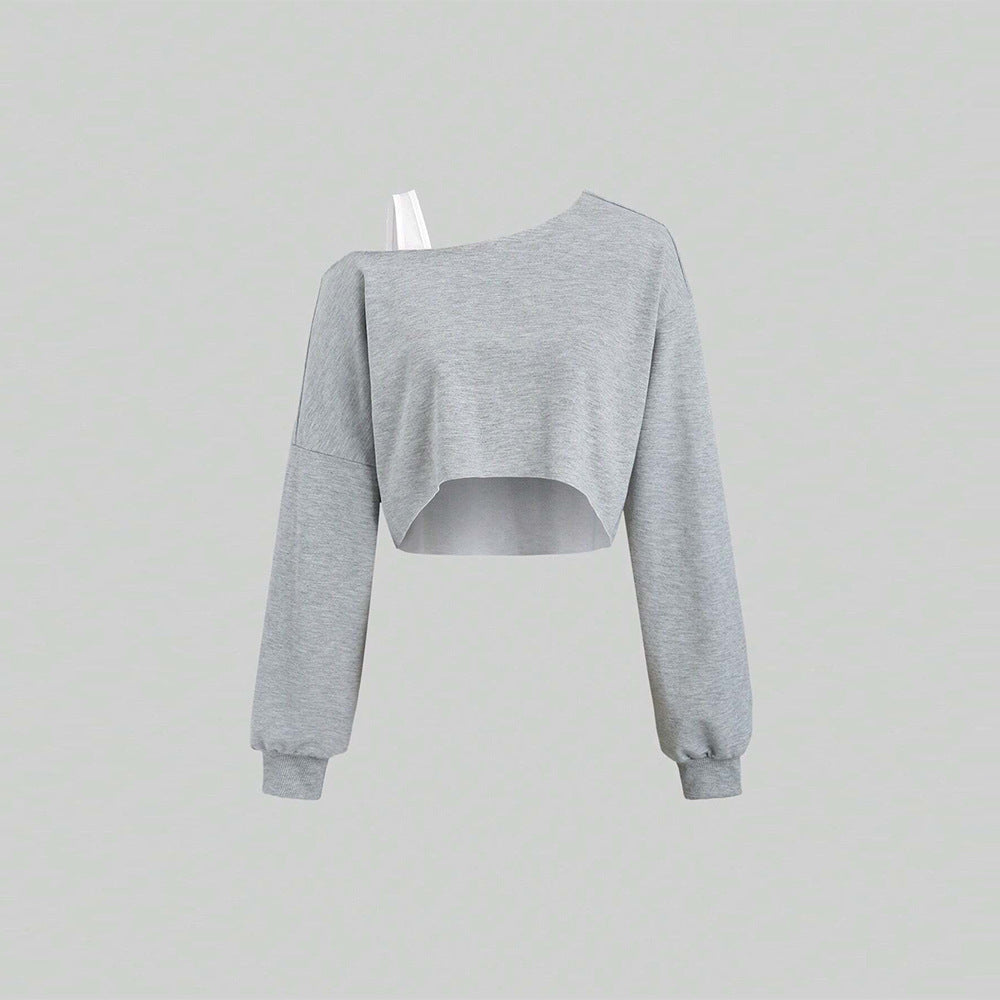 Kvindernes cropped sweatshirt med asymmetrisk design og voluminøse ærmer Stilla