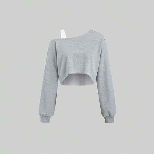 Kvindernes cropped sweatshirt med asymmetrisk design og voluminøse ærmer Stilla