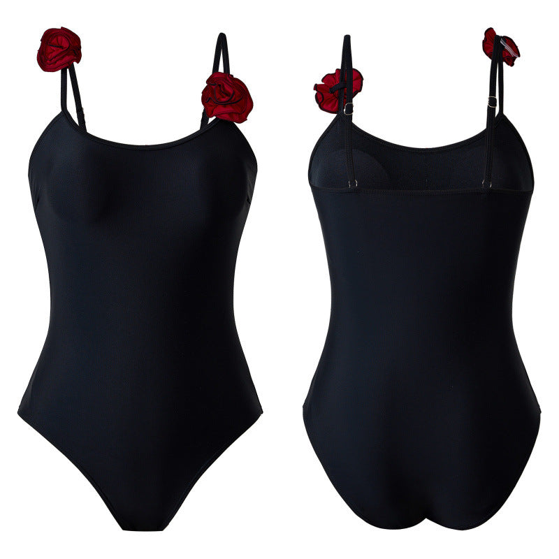 Dame one-piece badedragt med dekorative blomsterapplikationer og elegant indpakningsskørtek Skovae