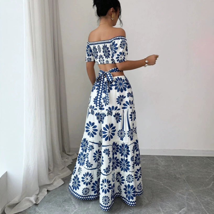 Dame maxikjole med blomstret design og trendy off-shoulder udskæring Skovae