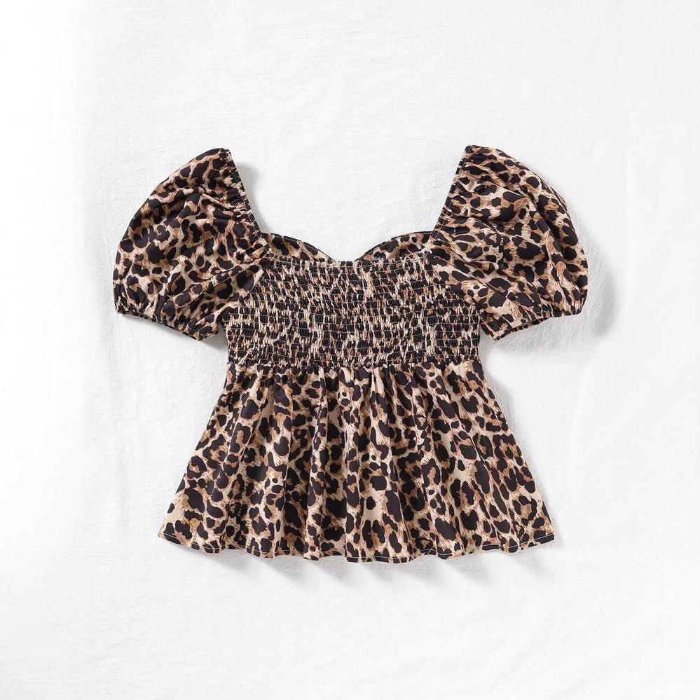 Dame bluse top med trendy leo mønster og voluminøse pufærmer Stilla