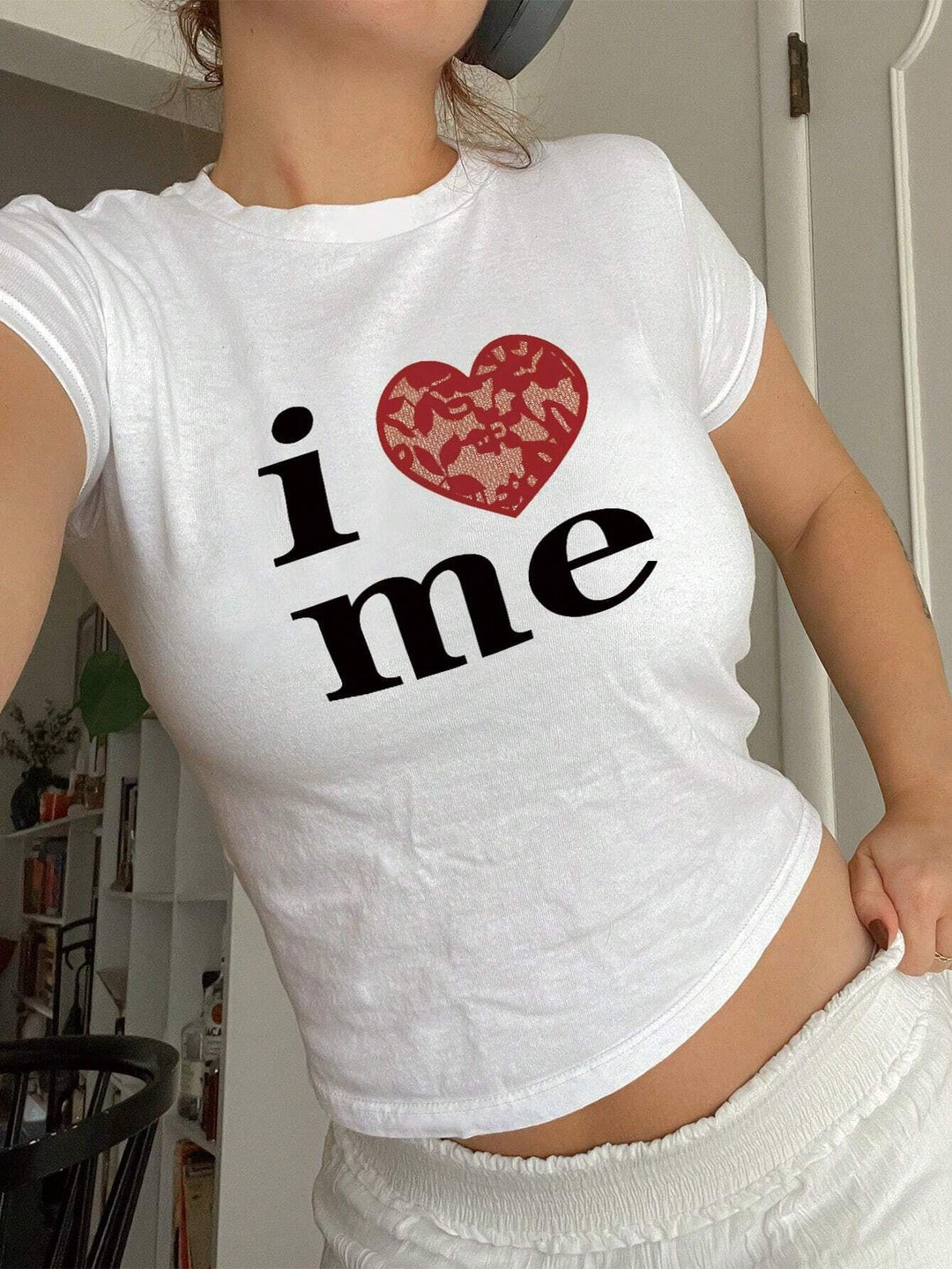 Dame T-shirt med glitrende diskokuglemotiv og tidssvarende sløjfedetalje Skovae