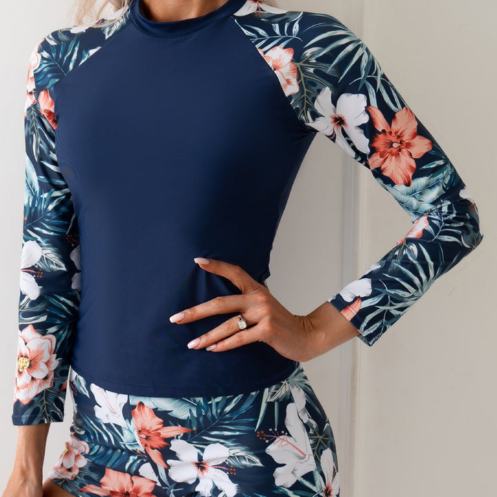 Dame Surfdragt med floral langærmet top og sports shorts Stilla