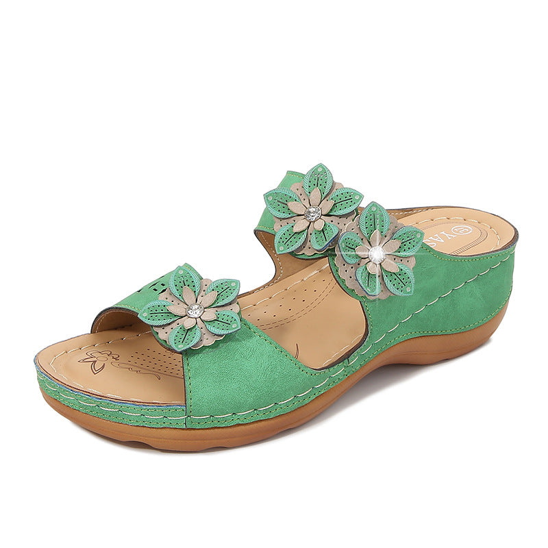 Dame pantoletten med florale accenter og ergonomisk design Stilla