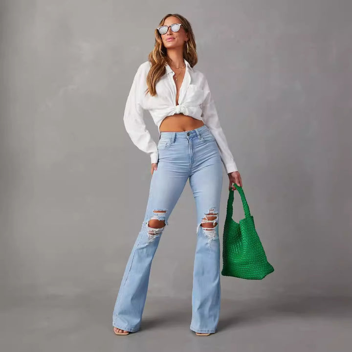 Kvinde bell jeans med trendy slidte detaljer og høj talje Skovae