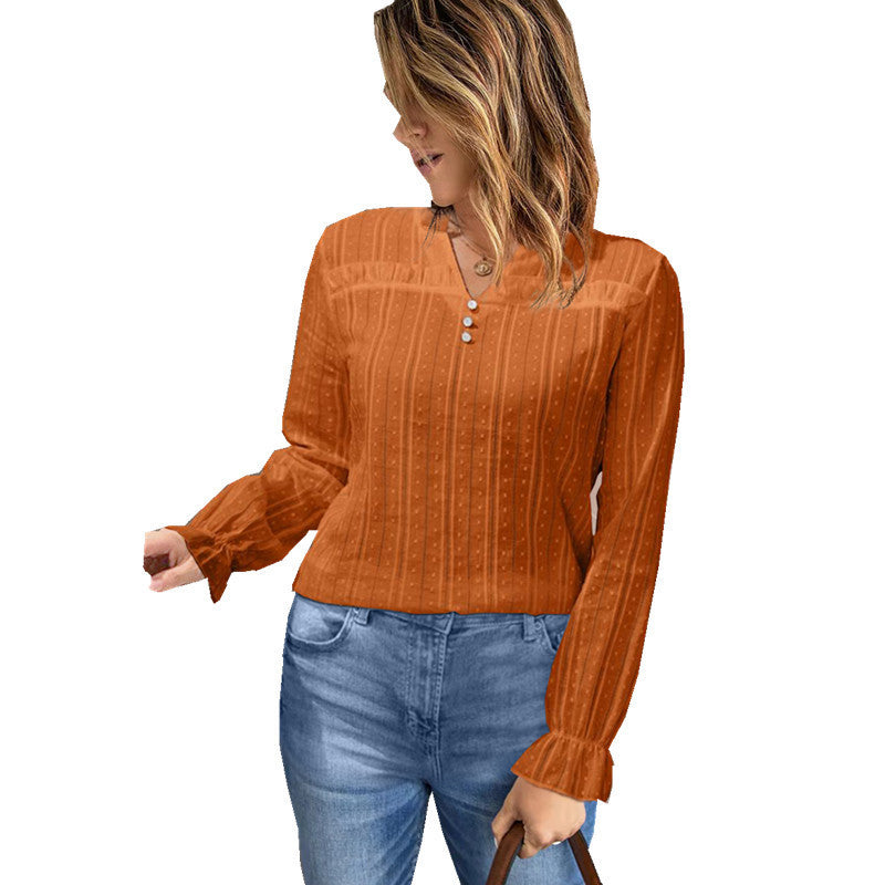 Damebluse med fin struktur og elegante knapdetaljer Stilla