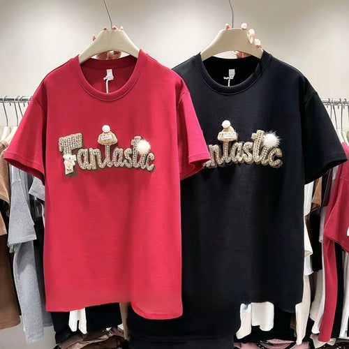 Dame T-shirt med stilfuld skrift og iøjnefaldende applikationer Stilla