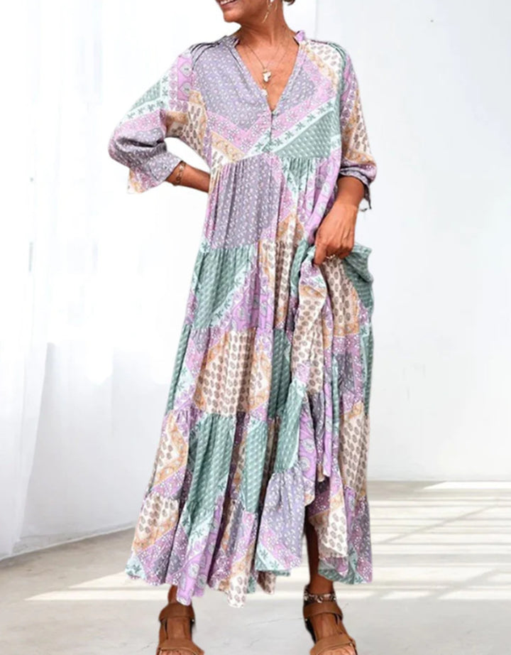 Dame maxidedragt med unikt patchwork-design og sidelommer Stilla