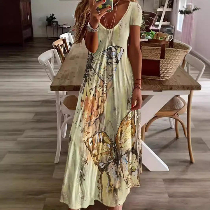 Dame Maxikjole med blomsteragtige sommerfuglemotiv og blødt flydende stof Stilla