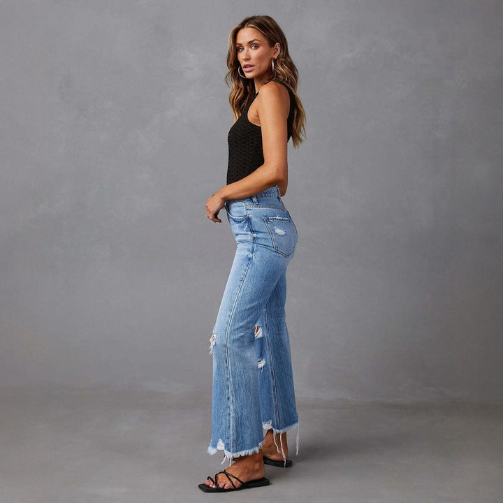 Dame flared jeans med stilfulde rifte detaljer og frynset kant Skovae