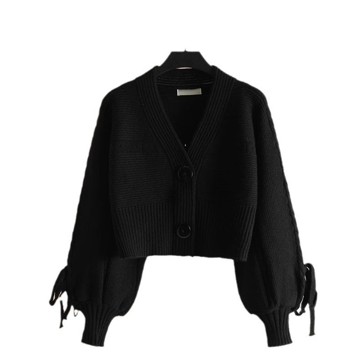 Kvinders fashionable cardigan med voluminøse ærmer og knap detaljer Stilla