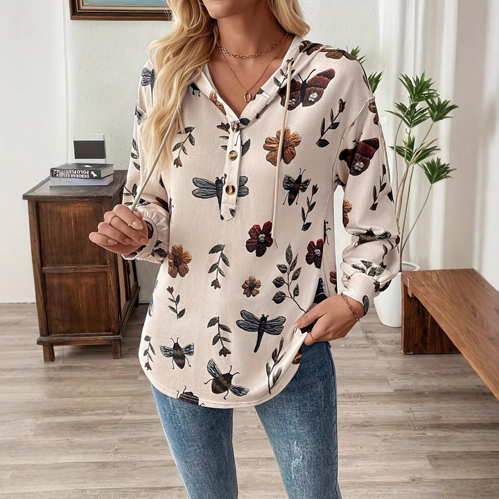Damebluse med blomsterprint og funktionelt knapdetalje med hætte Stilla