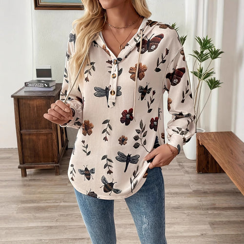 Damebluse med blomsterprint og funktionelt knapdetalje med hætte Stilla