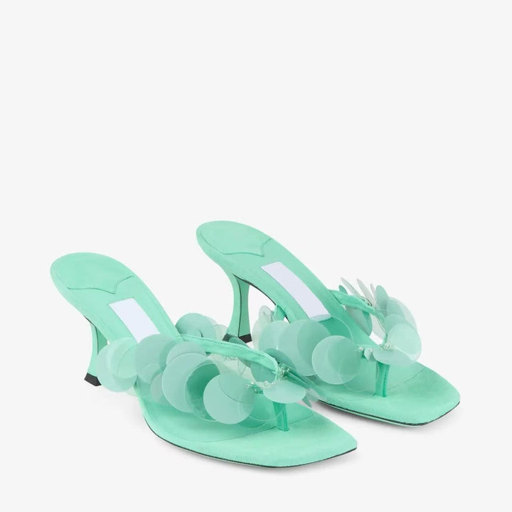 Femme Elegante Rutschsandaler med dekorative Disc Accenter Stilla