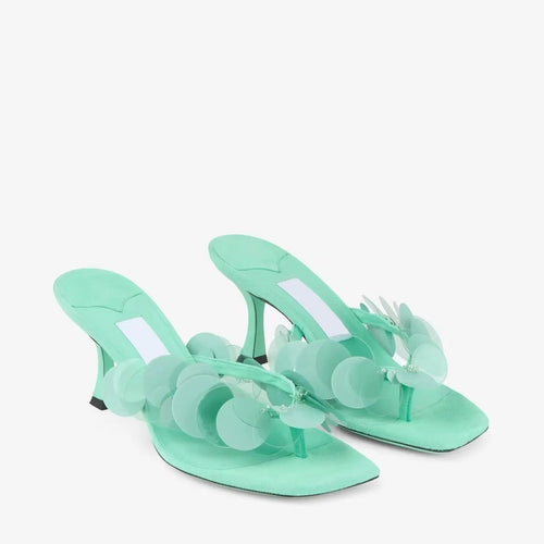 Femme Elegante Rutschsandaler med dekorative Disc Accenter Stilla