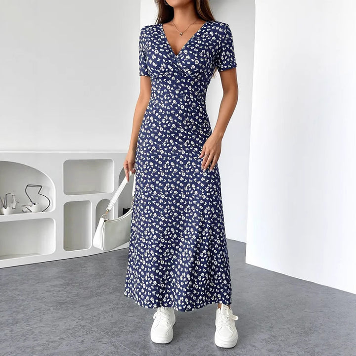 Dame Maxikjole med floral indpakningsdesign og praktiske sidelommer Stilla