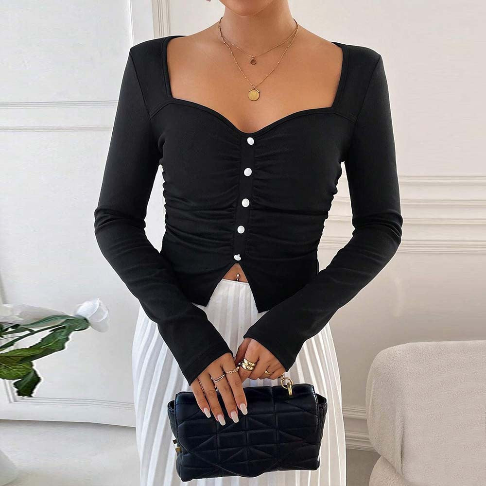 Kvindernes langærmede crop top med dekorative knapdetaljer og sammensyning Stilla