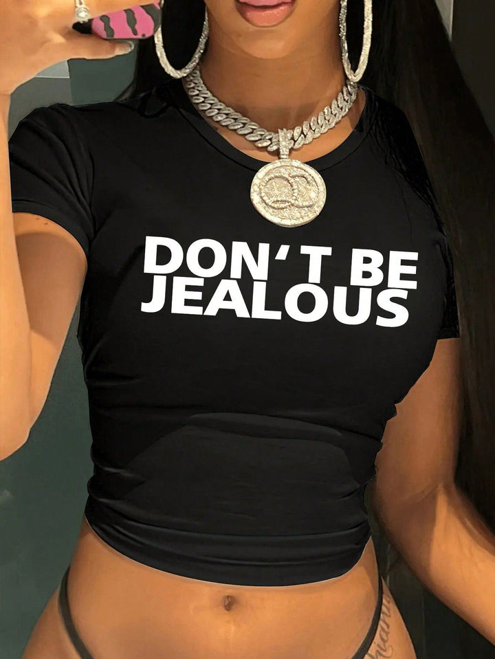 Dame Crop-T-Shirt med kunstnerisk statementtryk Skovae