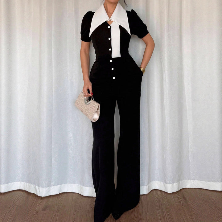 Dame jumpsuit med elegant krave og tætsiddende snit Skovae