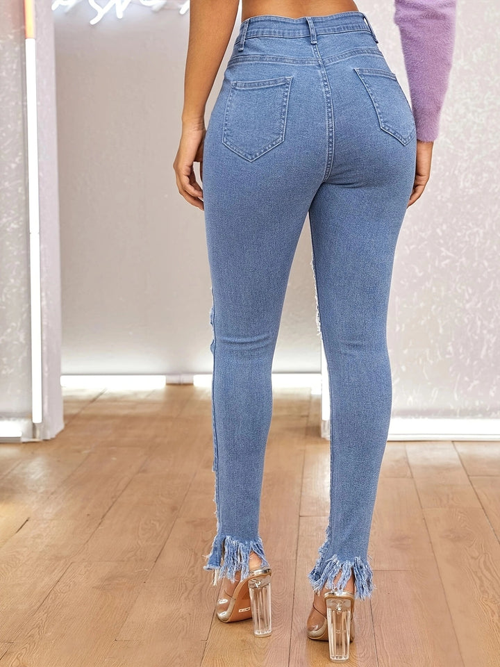Dame Skinny Jeans i moderigtige Destroyed-design med frynsed kant og høje slids Stilla