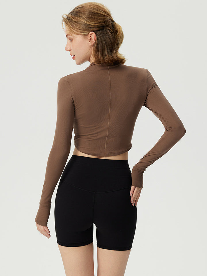 Dame sporty langærmet crop top med høj krave og åndbar struktur Stilla