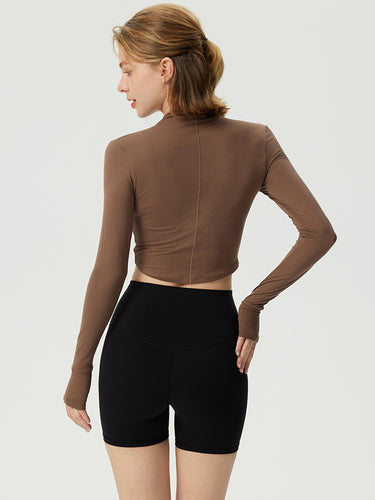 Dame sporty langærmet crop top med høj krave og åndbar struktur Stilla