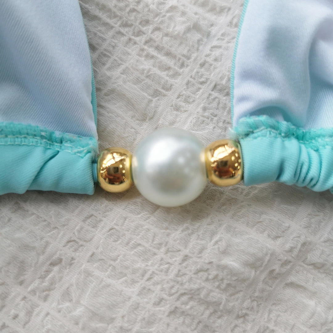 Dame bikini-sæt med moderne trekants-top og elegant perle-detalje Stilla
