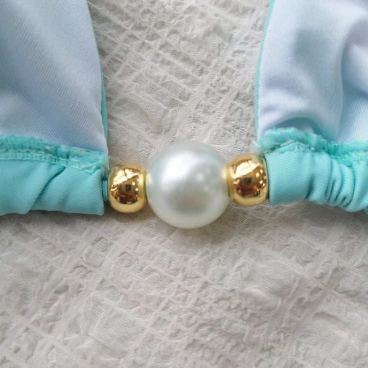 Dame bikini-sæt med moderne trekants-top og elegant perle-detalje Stilla
