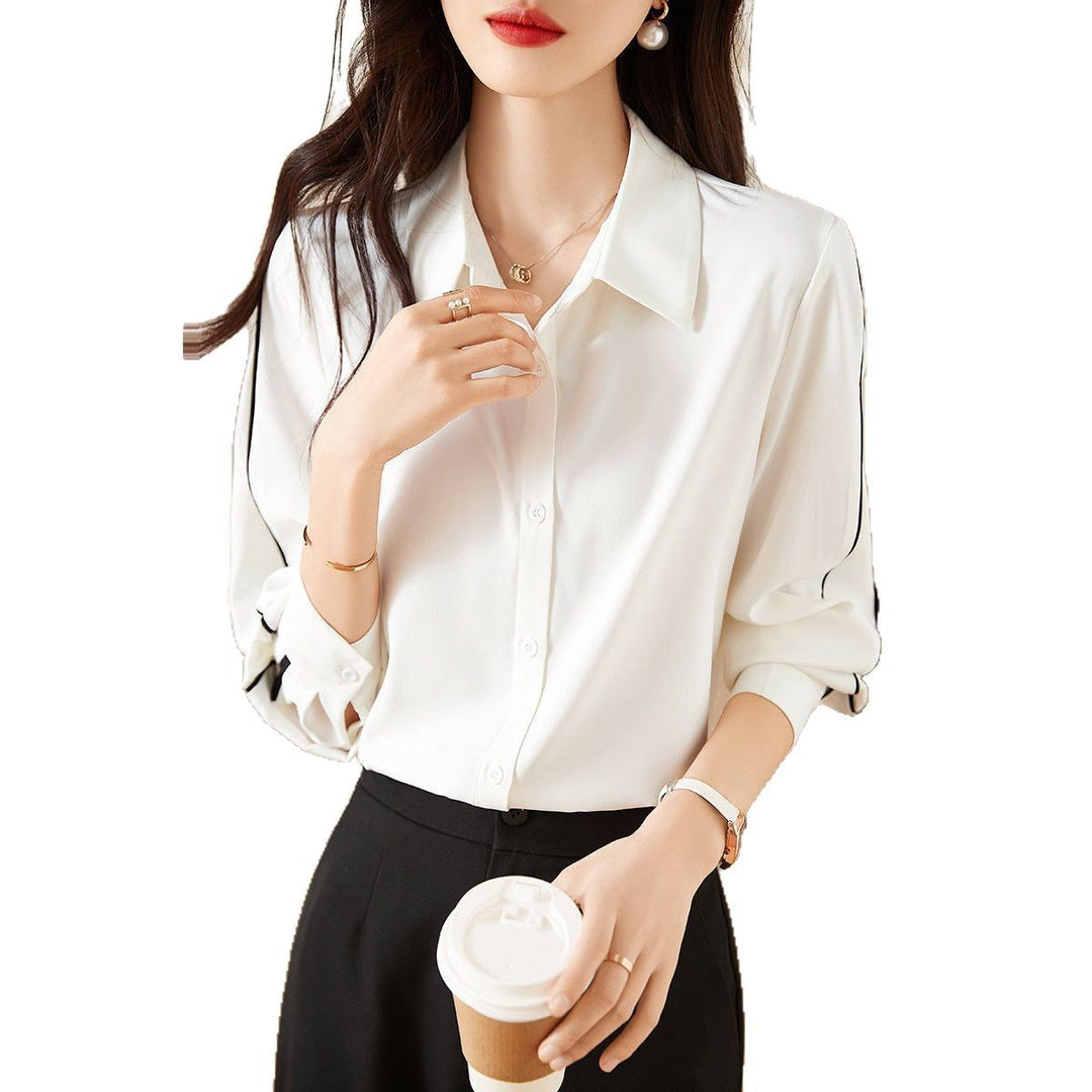 Damernes elegante bluse med klassiske knapdetaljer Stilla