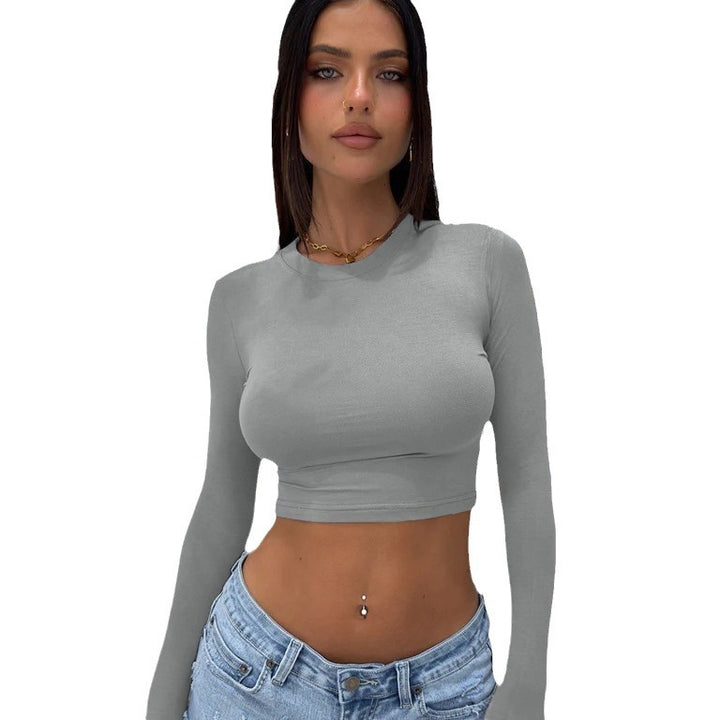Dame tætsiddende langærmet crop-top med trendy snit og elastisk materiale Stilla